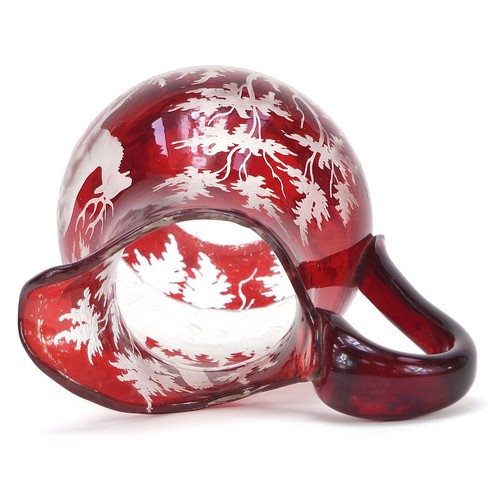 73 - Bohemian ruby flashed glass jug etched with a deer in a landscape, 9cm high