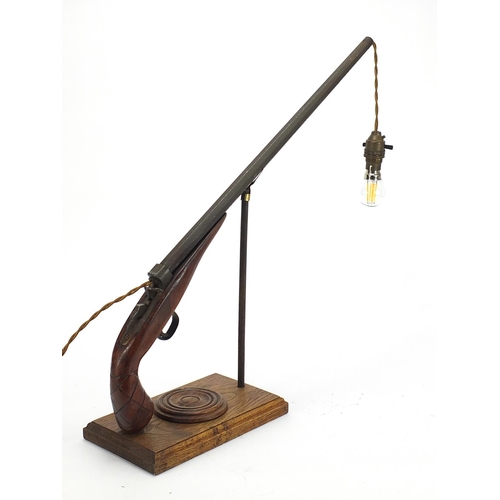 39 - Industrial antique gun design table lamp, 50cm high