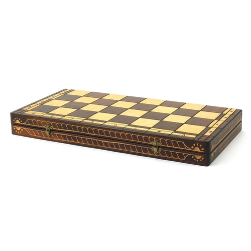 2061 - Large carved wood chess set with folding board, the largest pieces each 14cm high, the board 60cm x ... 