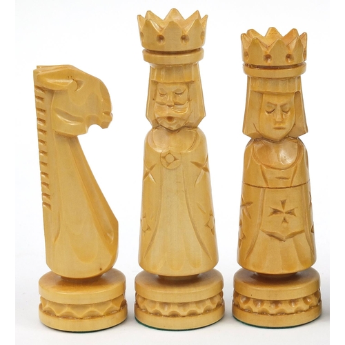 2061 - Large carved wood chess set with folding board, the largest pieces each 14cm high, the board 60cm x ... 