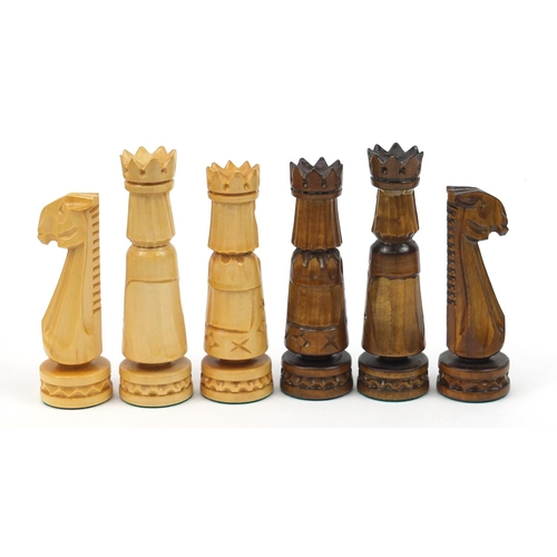 2061 - Large carved wood chess set with folding board, the largest pieces each 14cm high, the board 60cm x ... 