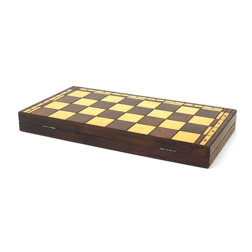 2061 - Large carved wood chess set with folding board, the largest pieces each 14cm high, the board 60cm x ... 