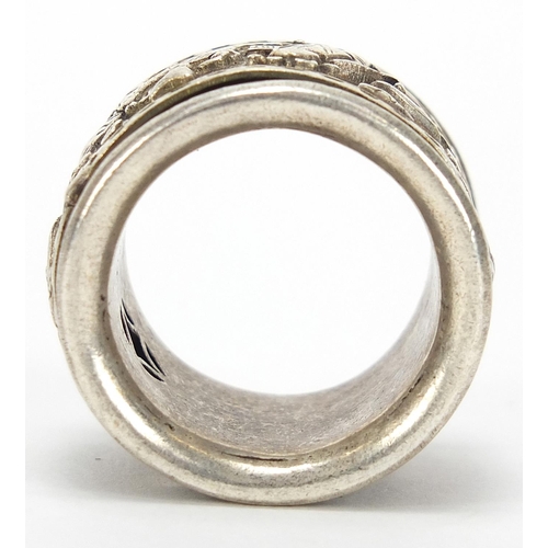 1958 - Chinese silver coloured metal archer's ring with rotating band, size Z