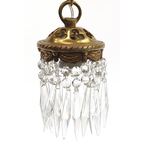 35 - Gilt bronze cherub light fitting with cut glass drops, 32cm in length