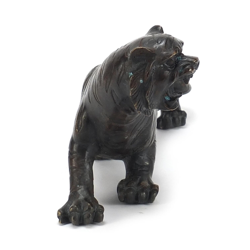 653 - Large Japanese patinated bronze tiger, 31cm in length