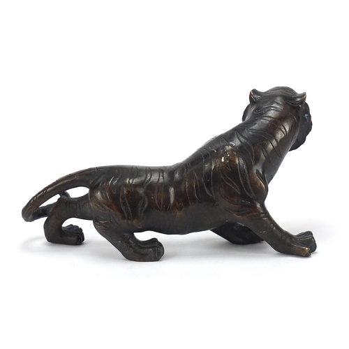 653 - Large Japanese patinated bronze tiger, 31cm in length