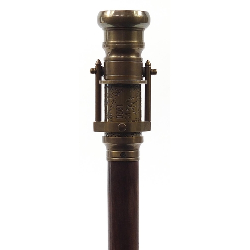 875 - Hardwood walking stick with brass two draw telescope and compass pommel, 96cm in length