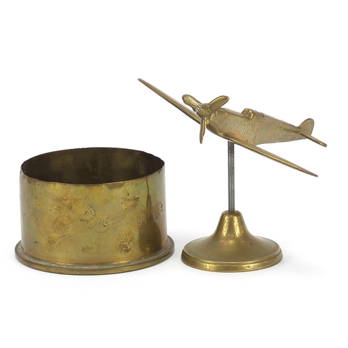 1955 - Military interest brass Spitfire and a trench art shell, the largest 20cm wide