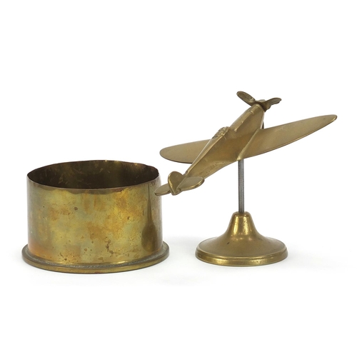 1955 - Military interest brass Spitfire and a trench art shell, the largest 20cm wide