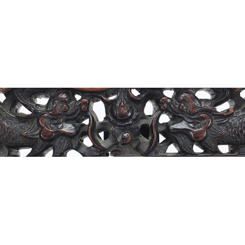 760 - Chinese hardwood easel frame, possibly Zitan, deeply carved with two dragons chasing a flaming pearl... 