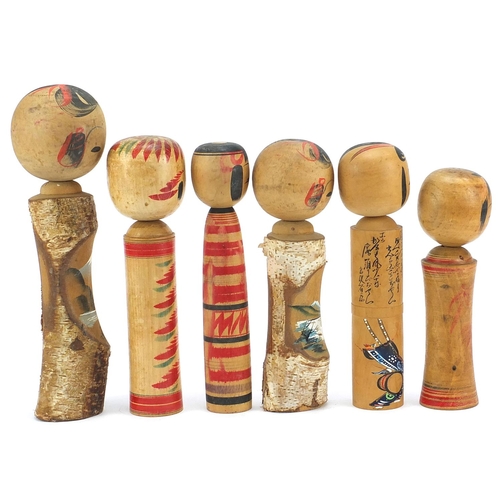 765 - Six Japanese Kokeshi hand painted wood dolls, the largest 29cm high