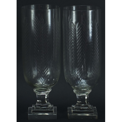 580 - Pair of Regency design cut glass celery vases with square stepped bases, 34cm high