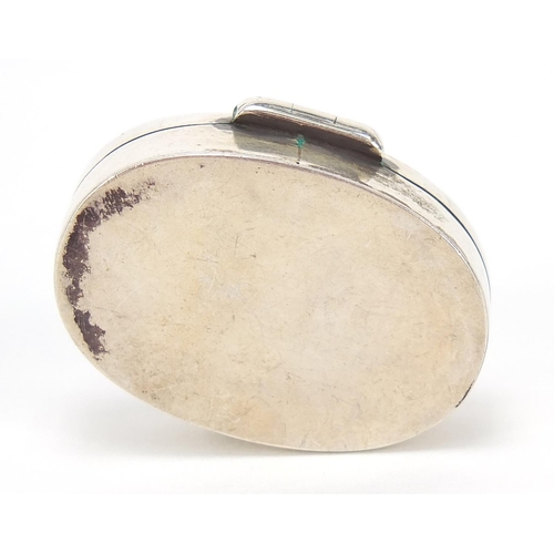 793 - Oval sterling silver pill box, the hinged lid enamelled with a  female golfer, 3.2cm wide, 11.5g