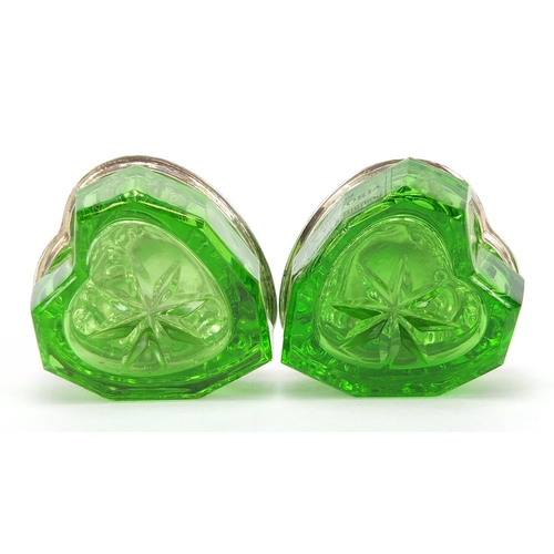 131 - Lauren Victoria, pair of green cut glass love heart shaped boxes with sterling silver lids, 3.5cm de... 