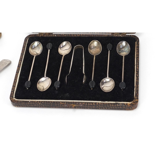 1119 - Silver items comprising coffee bean spoons and sugar tongs with fitted case, three antique spoons an... 