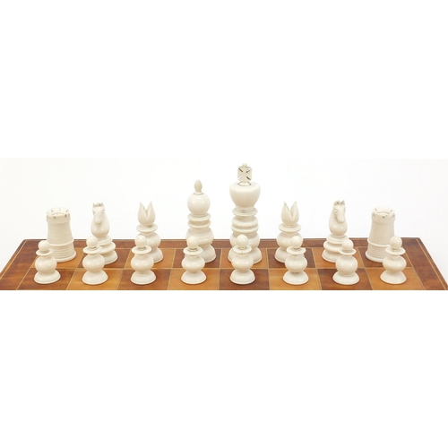 926 - 19th century Anglo Indian half stained St George patterned ivory chess pieces with later tooled leat... 