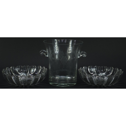 2058 - Champagne bucket with twin handles engraved with berries amongst leaves and a pair of shell shaped s... 