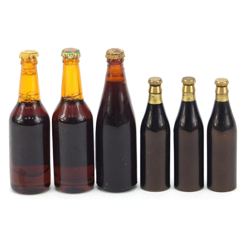 2119 - Three miniature alcohol bottles including Guinness and three Tolly Royal bottle openers