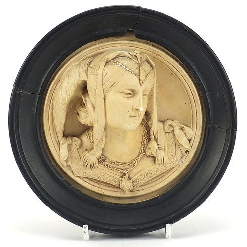 2089 - Classical plaster relief plaque of a maiden housed in an ebonised frame, overall 16cm in diameter