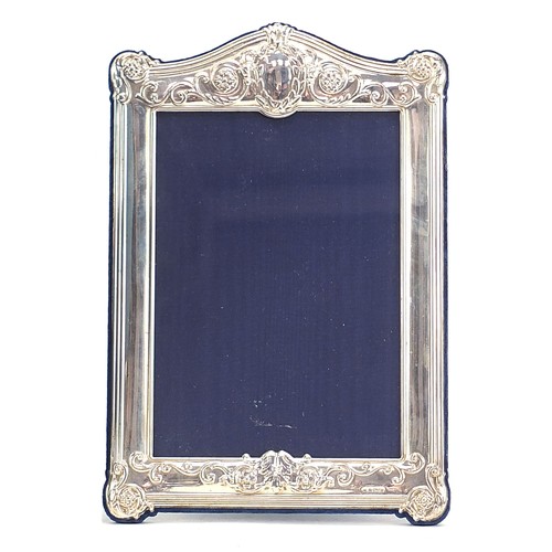 1123 - Carrs, rectangular silver easel photo frame with box, embossed with swags and flowers, Sheffield 199... 