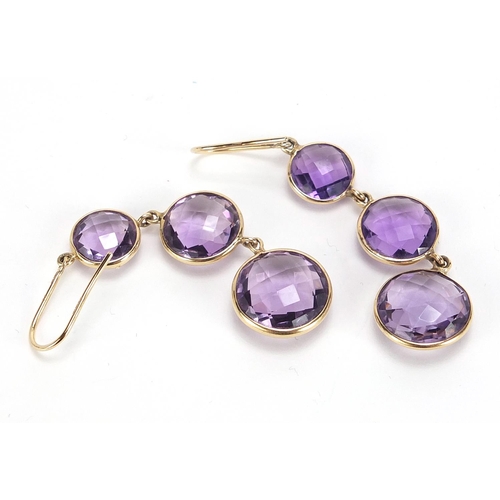 624 - Pair of 9ct gold graduated amethyst drop earrings, 6cm high, 8.9g