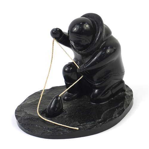 1003 - Boma, Canadian Inuit carving of an Eskimo fishing, 14.5cm in length