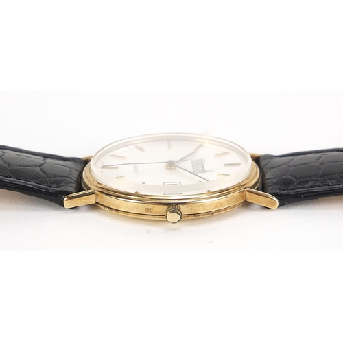 1134 - Marvin, gentlemen's 9ct gold quartz wristwatch with date aperture and box, 34mm in diameter