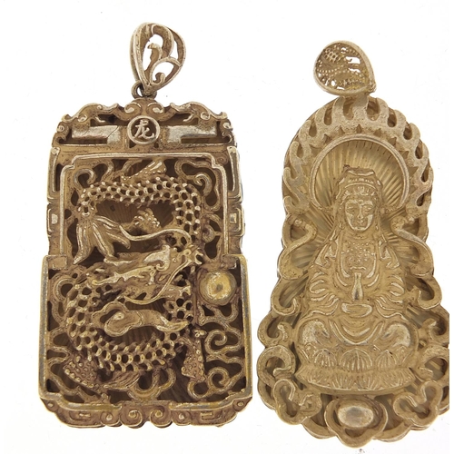 1830 - Two Chinese silver coloured metal pendants and one other, the largest 6.5cm high