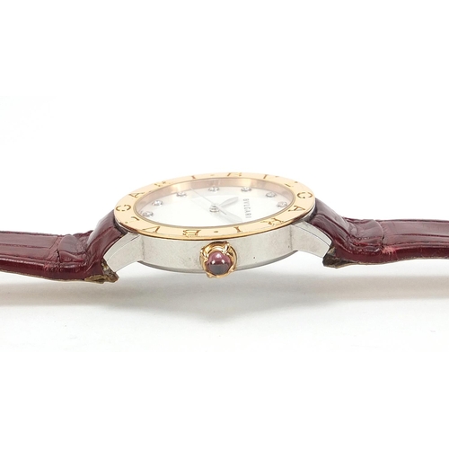 1135 - Bvlgari, 18ct gold automatic ladies wristwatch with diamond set mother of pearl dial and cabochon pu... 