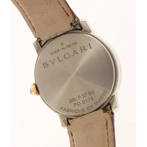 1135 - Bvlgari, 18ct gold automatic ladies wristwatch with diamond set mother of pearl dial and cabochon pu... 