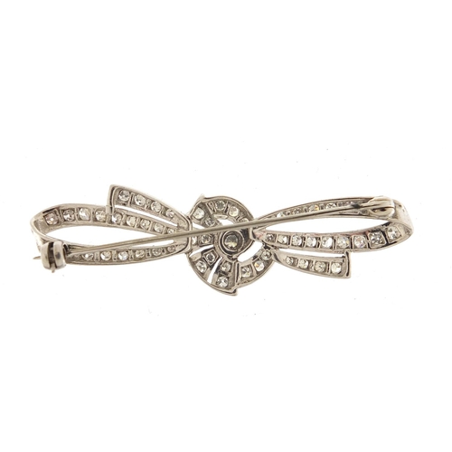 698 - Good unmarked white gold diamond bow brooch, 5cm wide, 5.7g