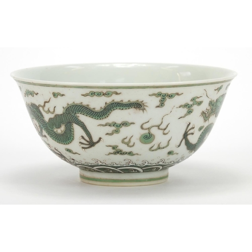 379 - Chinese porcelain bowl finely hand painted in green with two dragons chasing a flaming pearl above c... 