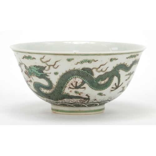 379 - Chinese porcelain bowl finely hand painted in green with two dragons chasing a flaming pearl above c... 