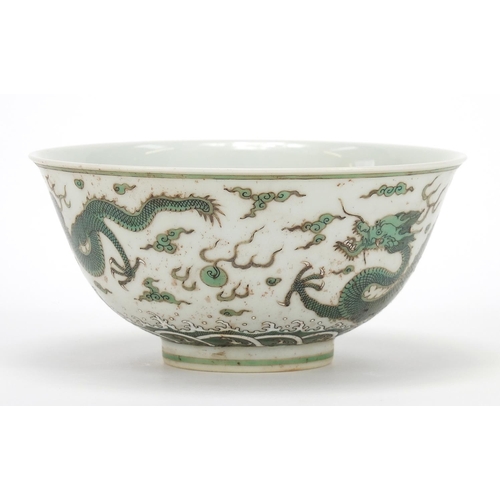 379 - Chinese porcelain bowl finely hand painted in green with two dragons chasing a flaming pearl above c... 