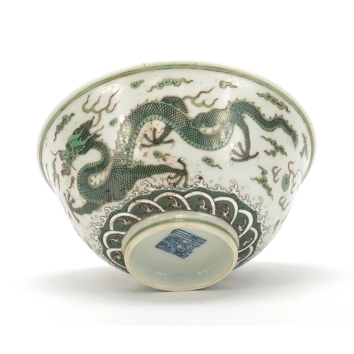 379 - Chinese porcelain bowl finely hand painted in green with two dragons chasing a flaming pearl above c... 