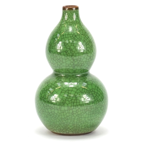 377 - Chinese porcelain crackle glazed double gourd vase having a green monochrome glaze, 15cm high