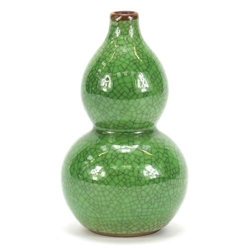 377 - Chinese porcelain crackle glazed double gourd vase having a green monochrome glaze, 15cm high