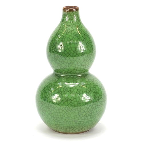 377 - Chinese porcelain crackle glazed double gourd vase having a green monochrome glaze, 15cm high