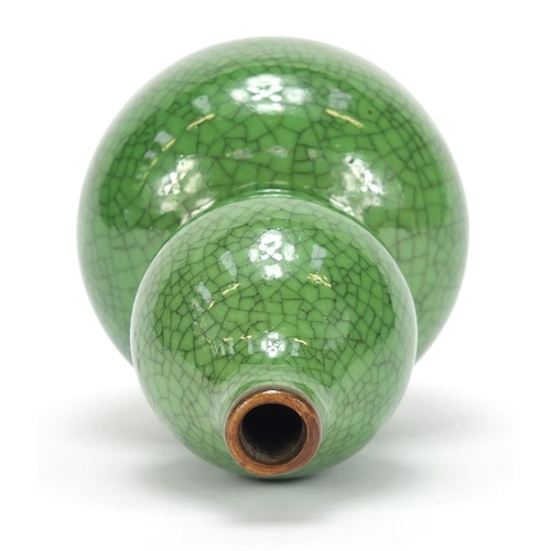 377 - Chinese porcelain crackle glazed double gourd vase having a green monochrome glaze, 15cm high