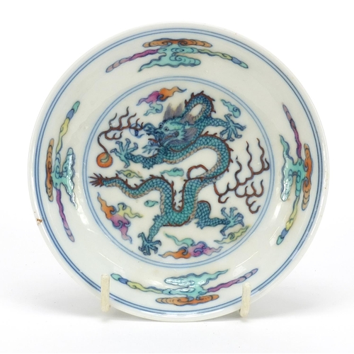 57 - Chinese doucai porcelain dish hand painted with a dragon amongst clouds, six figure character marks ... 