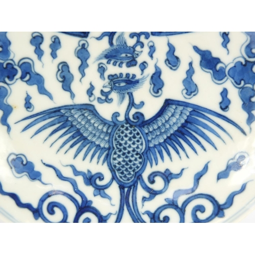 750 - Pair of Chinese blue and white porcelain dishes hand painted with phoenixes amongst clouds, each wit... 