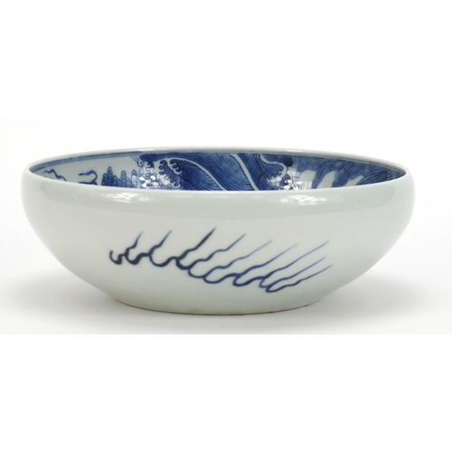 442 - Chinese blue and white porcelain bowl hand painted with a dragon amongst clouds above waves, blue ri... 