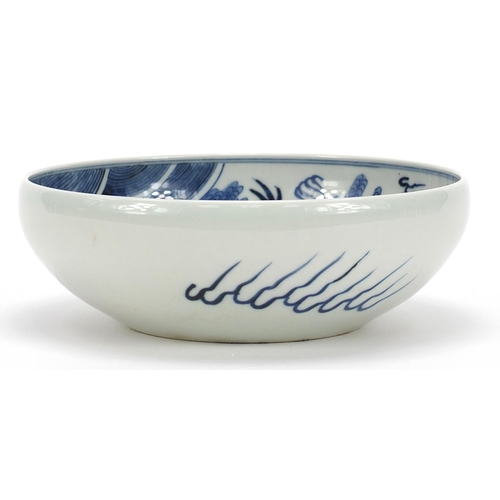 442 - Chinese blue and white porcelain bowl hand painted with a dragon amongst clouds above waves, blue ri... 