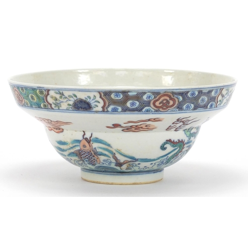 746 - Chinese doucai porcelain bowl hand painted with dragons and fish amongst aquatic life, six figure ch... 