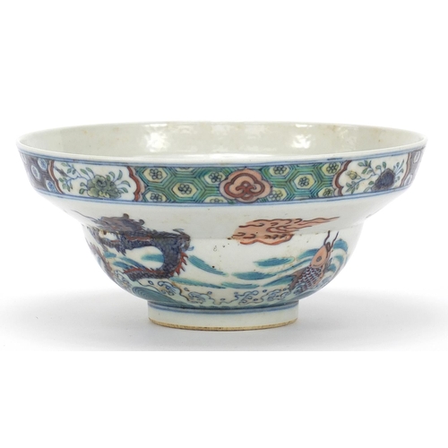 746 - Chinese doucai porcelain bowl hand painted with dragons and fish amongst aquatic life, six figure ch... 