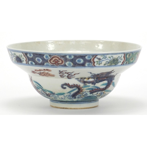 746 - Chinese doucai porcelain bowl hand painted with dragons and fish amongst aquatic life, six figure ch... 