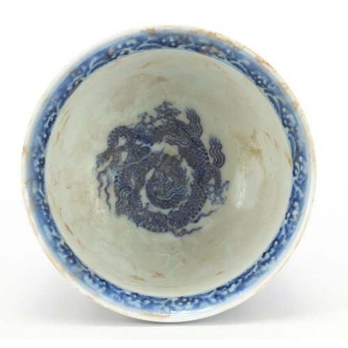 376 - Chinese blue and white porcelain stem bowl hand painted with two dragons amongst waves, four figure ... 