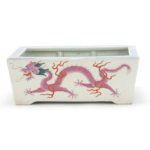 643 - Good Chinese porcelain planter finely hand painted in the famille rose palette with two dragons chas... 