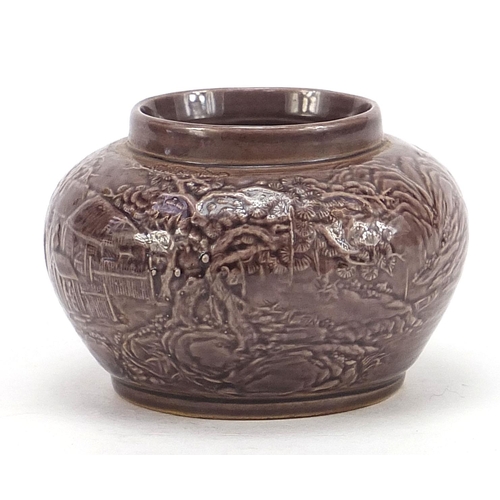 753 - Chinese porcelain vase having a purple glaze decorated in low relief with a continuous landscape, fo... 