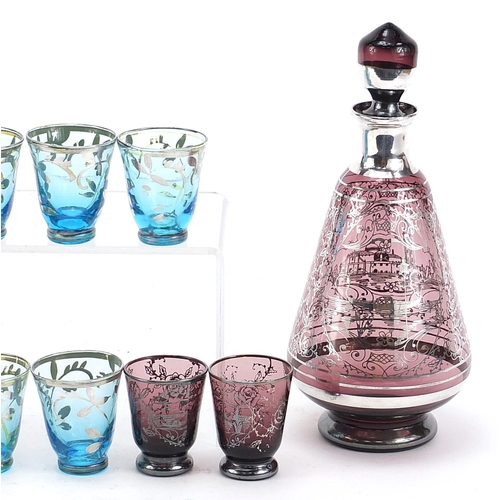 2006 - Vintage silver overlaid glass liqueur sets comprising two decanters and ten glasses, the largest dec... 